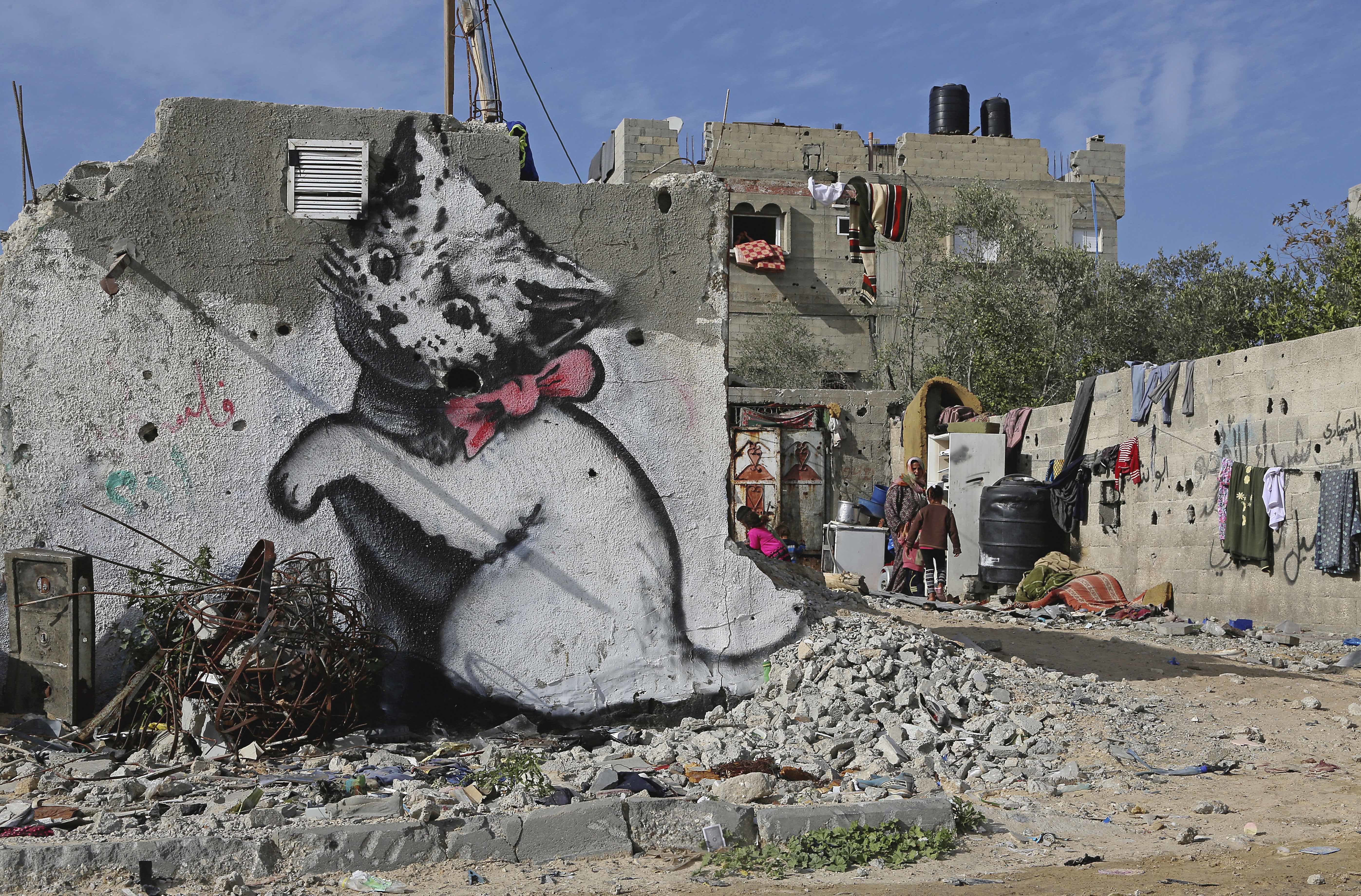 Mysterious graffiti artist Banksy illustrates Gaza debris